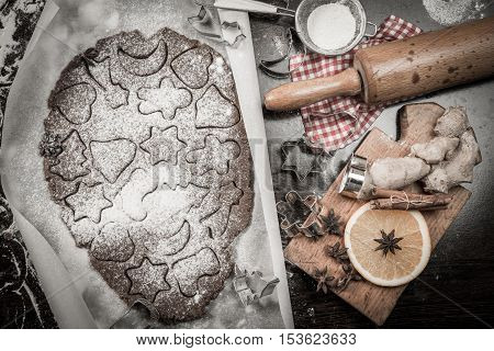 Preparing homemade Christmas cookies , gingerman dough