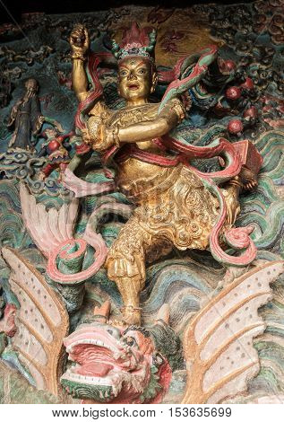 Statue of Kuixing god of fate at western hills, Yunnan, China