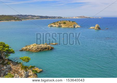 Gargano coast: bay of Vieste.-(Apulia) ITALY-In the foreground the island Gattarella and in the background the town of Vieste.
