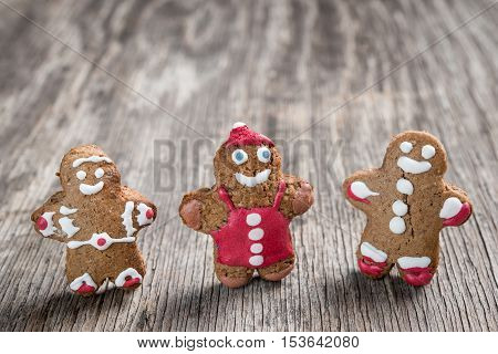 Tree Decorated Gingerman Cookies On Rustic Wooden Background