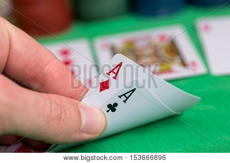 poker player holdi play cards with chips and money