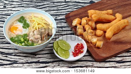 Rice porridge with mined pork and chicken lever with Patongko (deep-fried dough stick)