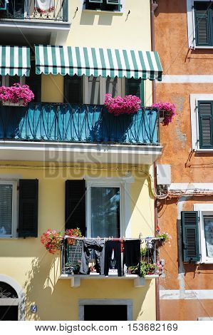 A colorful balcony in Italian town on summer day