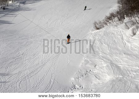 Skiers On Ski Slope At Sun Winter Day