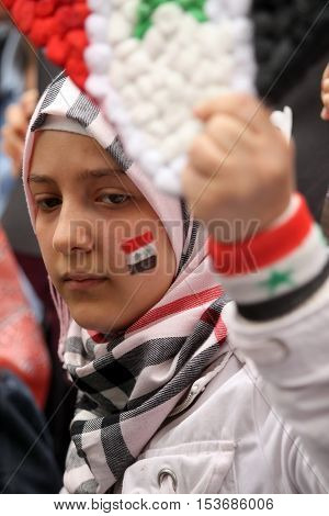 ISTANBUL,TURKEY-DECEMBER 2: Unidentified Syrians living in Istanbul protest the regime of Bashar Essad in front of Syrian Consulate on December 2, 2011 in Istanbul,Turkey.