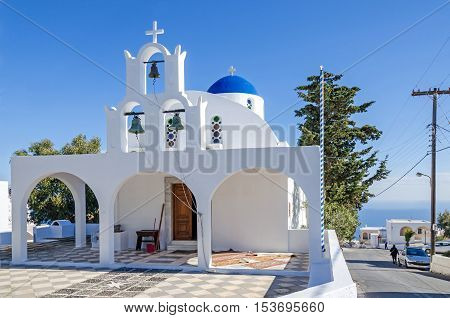 One of many typical chapels of Greek Orthodox Church on the greek island Santorini in Thira with its typical blue painted dome and three bells