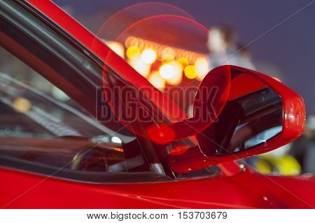 Close up view on the part of the red luxury car