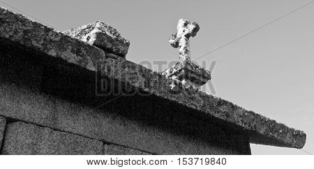 Detail of the of the cross on top of the all the granaries called espigueiros in Northern Portugal