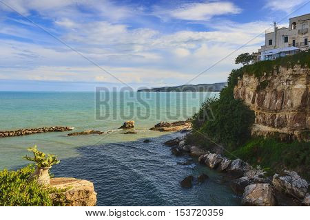 Summertime.Gargano coast: bay of Vieste.-(Apulia) ITALY-Panoramic view of the old town.