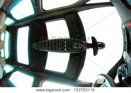 photo large sunroof inside car, sky and clouds