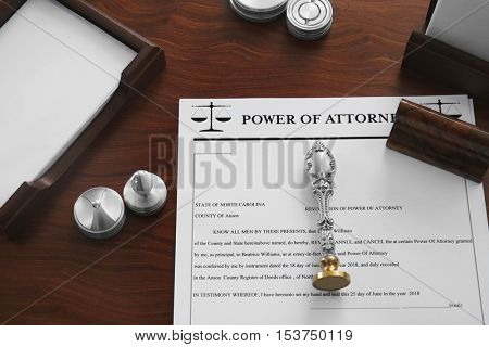 Pen, document, stamp and ink pads on notary public table
