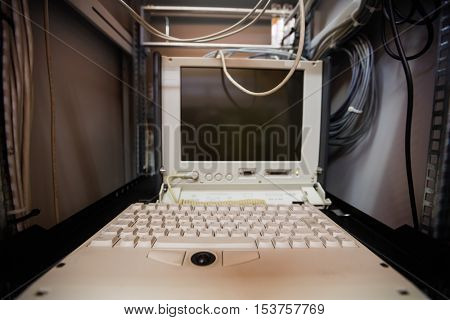 Computer in cabinet of a server room at office