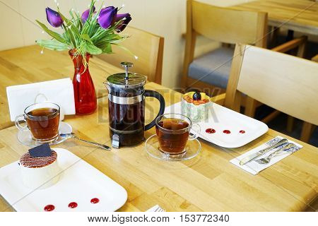 glass tea kettle with Turkish and Oriental sweets on the table