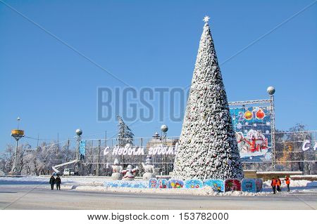 Volgograd Russia - December 22 2009: Snowy Christmas tree on on the Ploshhad' Pavshih Borcov (the Square of the Fallen Fighters) in Volgograd