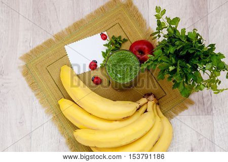 Vitamin smoothie in glass linen napkin on the kitchen table. Healthy eating. Cleansing Cocktail. Detox