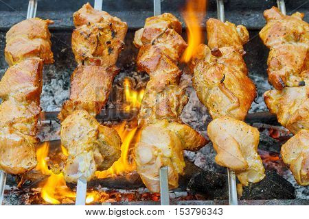 Closeup Of Some Meat Skewers Being Grilled In A Barbecue