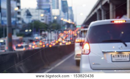 transportation vehicle and traffic concept - Blurred border bridge and Bokeh light of traffic jam evening in city life