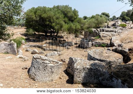 Cave di Cusa or Rocche di Cusa was an ancient stone quarry in Sicily. Its stone was used to construct the temples in the ancient Greek city Selinunte. The stone extraction was abandoned in 409 BC.