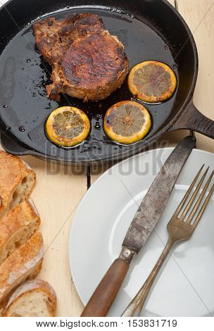 Pork Chop Seared On Iron Skillet