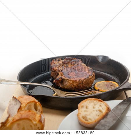 Pork Chop Seared On Iron Skillet