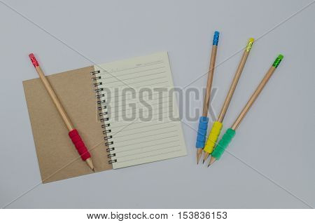 Recycled paper notebook open front cover on white background