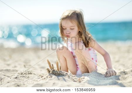 Little Girl Blowing Off Candles On An Imaginary Birthday Cake