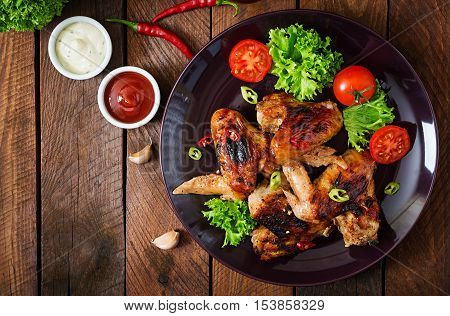 Baked Chicken Wings In The Asian Style On Plate. Top View