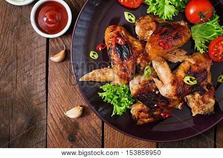 Baked Chicken Wings In The Asian Style On Plate. Top View