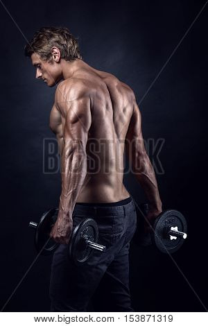 Muscular Bodybuilder Guy Doing Exercises With Dumbbells