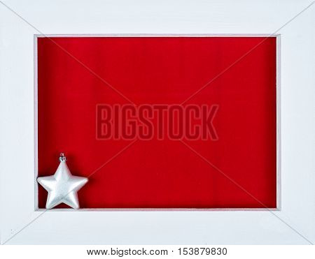 White Wooden Frame And A Star Over A Red Background
