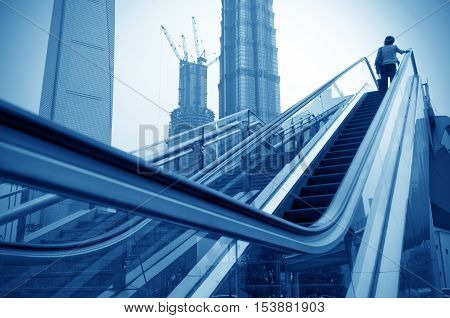 Shanghai street modern building skyscraper building escalator.