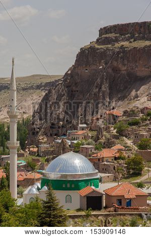 Moscue in small village besides abandoned cave town shot in sunny day in Turkey nobody