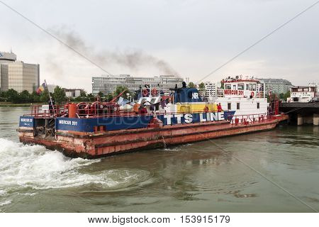 Vienna / Austria - July 21st 2014: Closeup picture of Mercur 201 romanian cargo boat pushing a barge on the Danube river