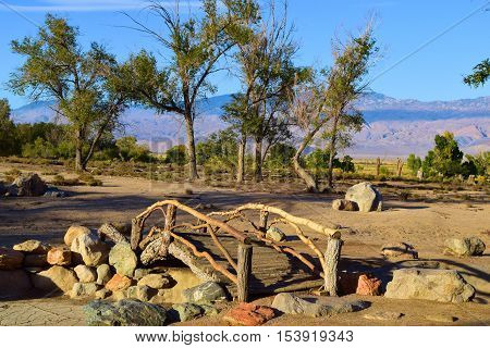 Wooden Bridge over a dry pond at a former Japanese Garden which is now abandoned taken at Manzanar War Relocation Camp near Independence, CA where Japanese Americans were housed during Word War 2