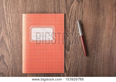 Colored Exercise Book On The Wooden Table