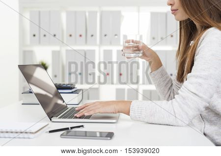 Girl In Gray Cardigan Drinking Water