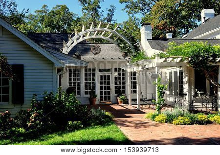 Pittsboro North Carolina - October 28 2016: Gardens and trellis terrace at the Five star luxury Fearrington House Hotel at Fearrington Village