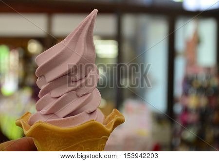 Delicious grape sherbet ice cream in cone