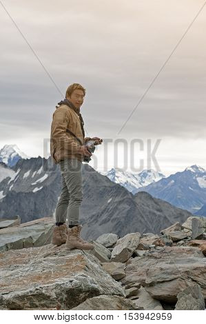 Male Model Posts From The Top Of Snowcapped Mountain Peak Around Aoraki Mount Cook And Mount Cook Na