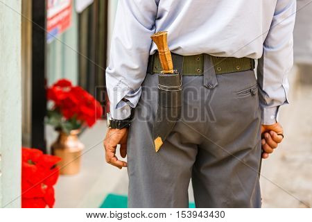Gurkha officer with gurkha knife attached to the back of his belt
