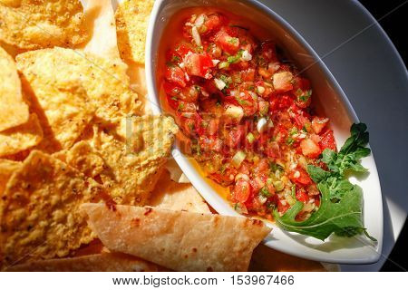 Tacos and tomato salsa-top view, close up, sunlit