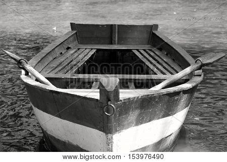The abandoned boat on the lake shore