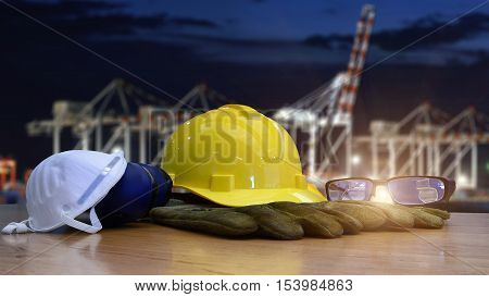 Double exposure of  Safety standard set and Container Cargo freight ship with working crane bridge for Logistic Import Export background . Occupation  health and safety at work  concept .