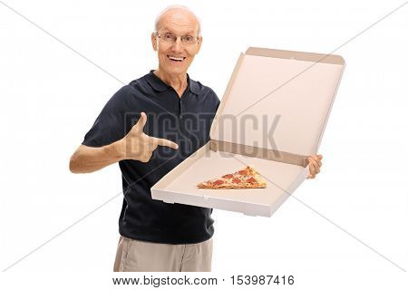 Happy senior holding a pizza box with a single slice and pointing isolated on white background