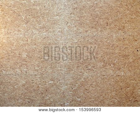 construction and building materials concept - particleboard wooden surface or board