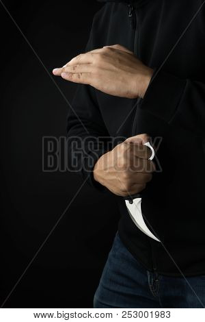 Crime And Violence Concept, A Murderer With A Karambit Knife Trying To Kill Victim