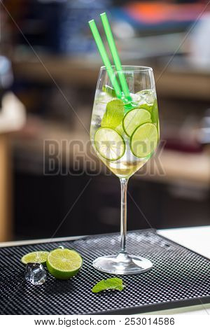 Cocktail Drink Or Lemonade With Cucumber On Barcounter.