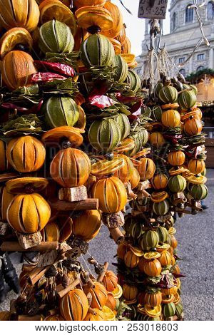 Colorful Xmas Decoretions With Dry Fruits To Hang With Oranges, Lemons And Cinnamoms