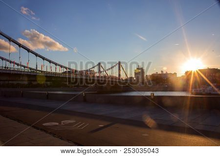 View Of Krymsky Bridge Through The Moskva River At Sunset