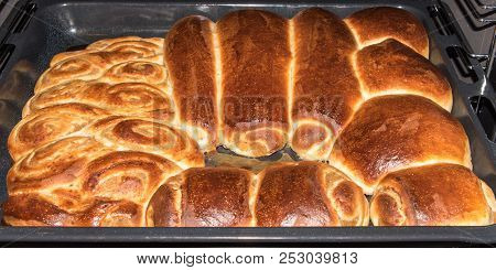 Baked Sweet Buns On A Baking Sheet With A Ruddy Crust, Homemade Delicious Cakes. Hot Buns On A Bakin